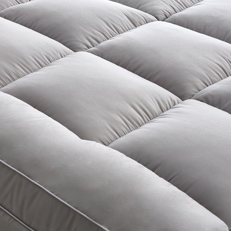 Close-up of the quilted WolkenTopper surface in Grey
