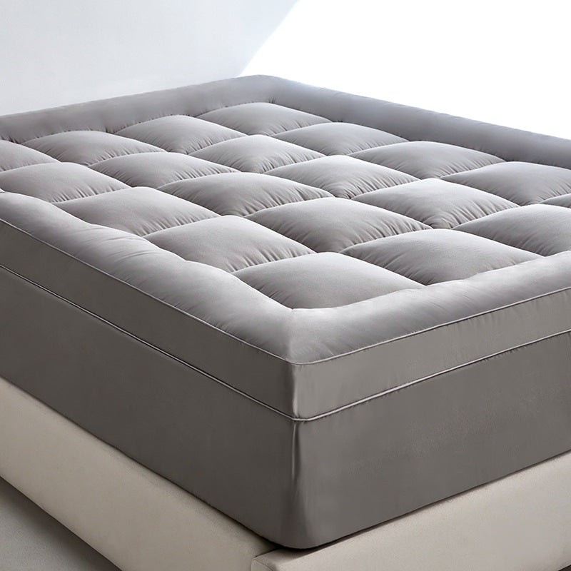 Side view of WolkenTopper in Grey on a bed